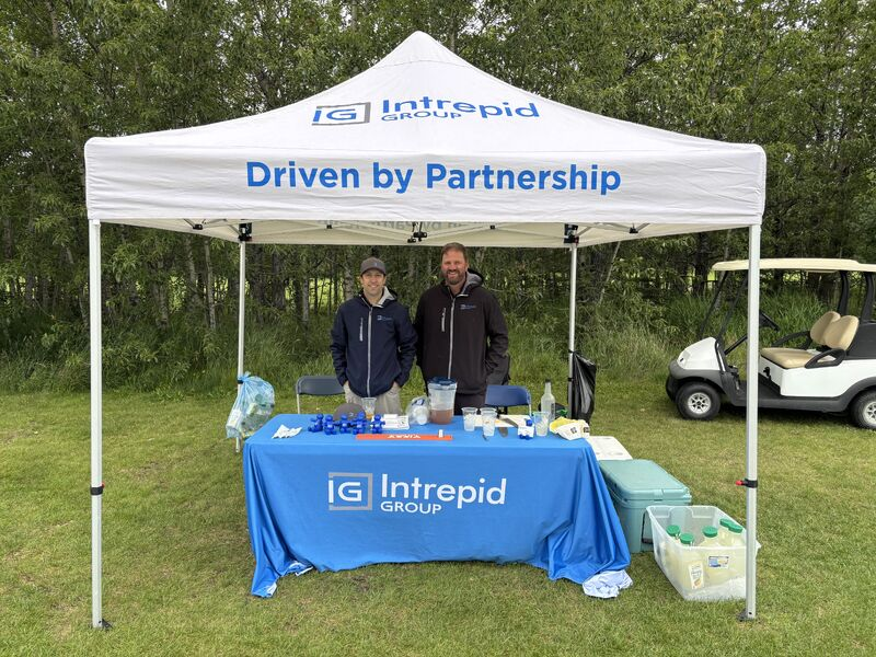 Intrepid Group hosting a booth at a charity golf tournament