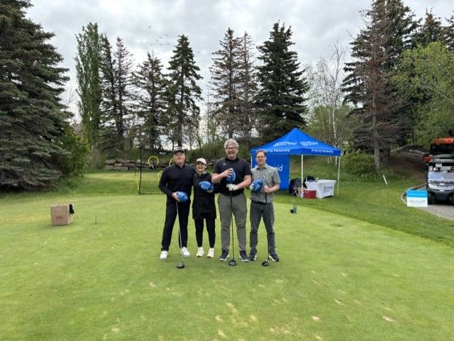 Intrepid team taking part in a golf tournament