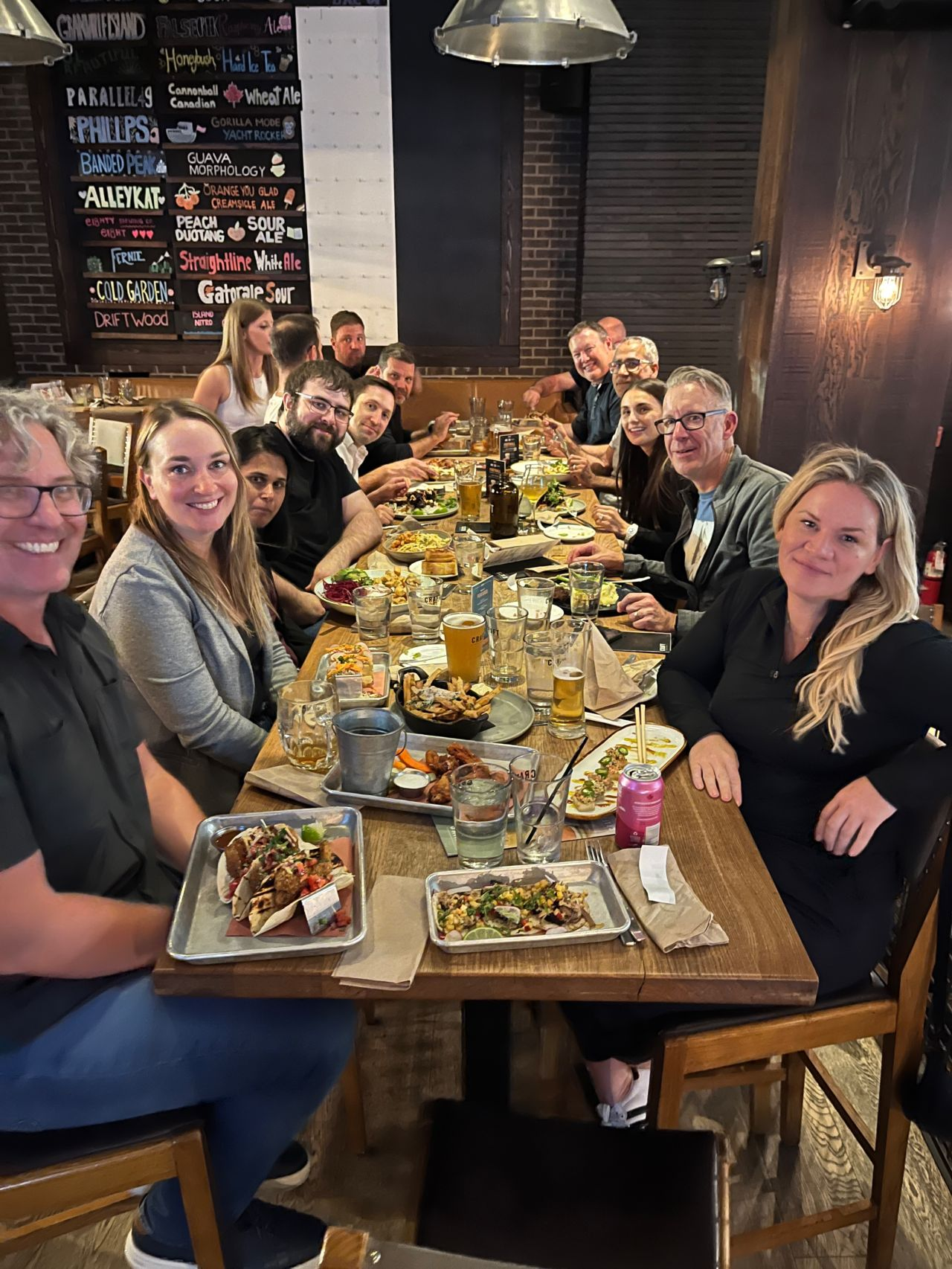 Intrepid team members sharing a meal at a group dinner